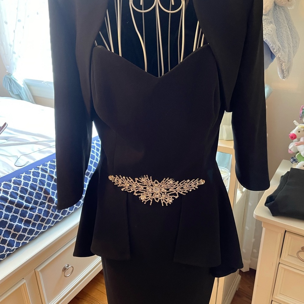 Gorgeous boutique dress with matching jacket.  Peplum and rhinestone design.